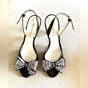 Anne Klein, black patent leather shoes, with black and white bows size 9